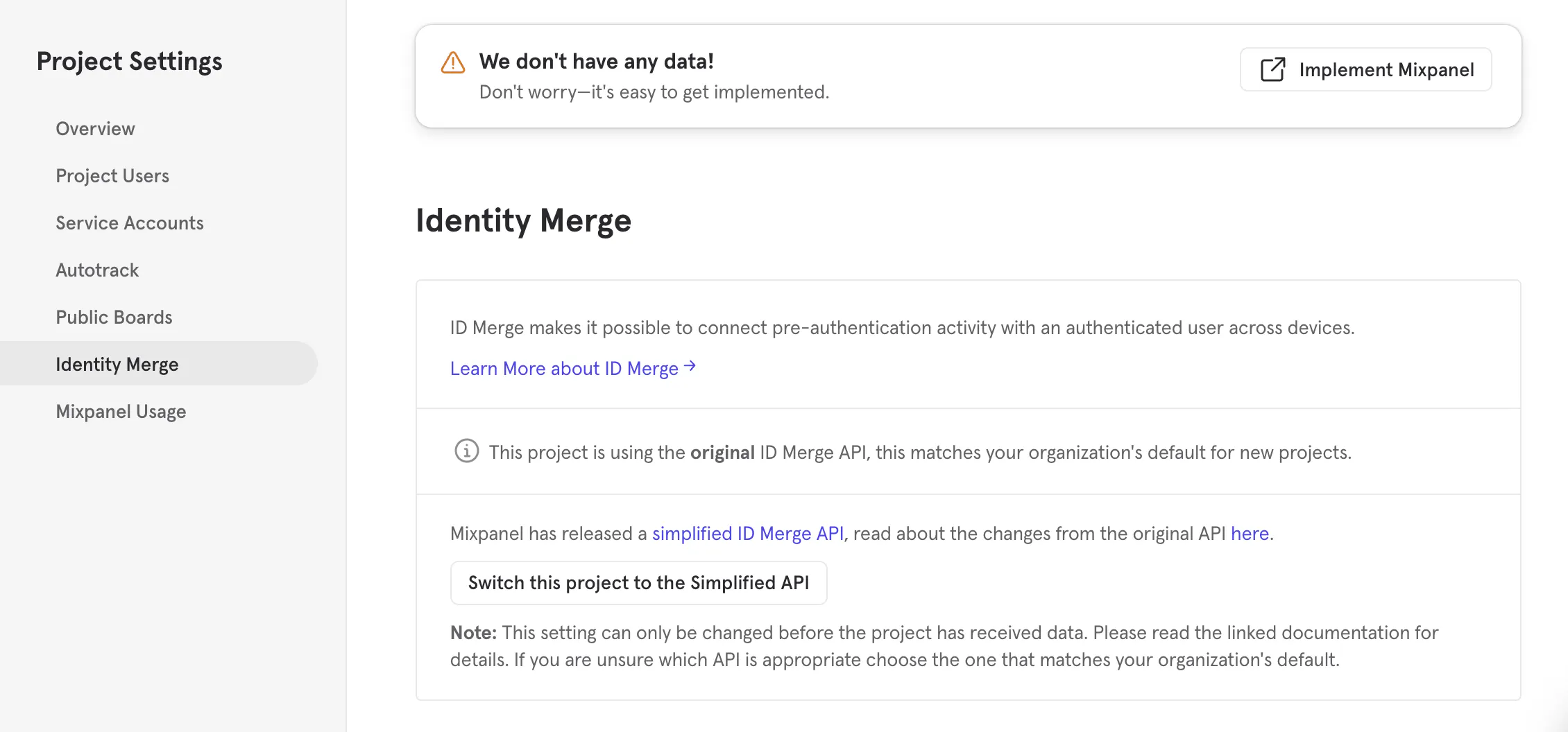 mixpanel's interface has an identity merge setting that supports a simple API