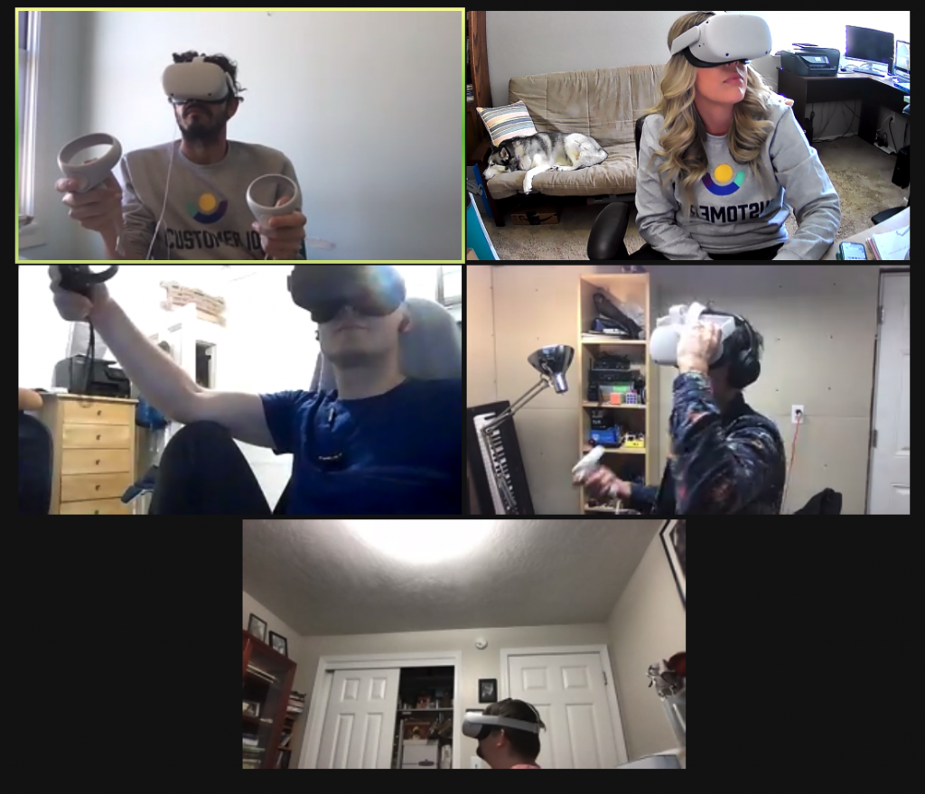 Five teammates trying out the VR headsets in preparation for the retreat.